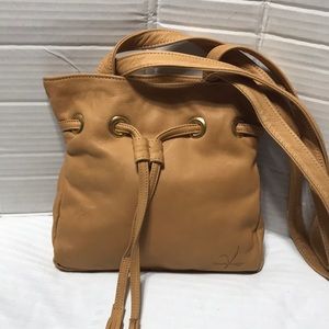 Victoria leather shoulder bag with draw string. Made in the USA. NWOT